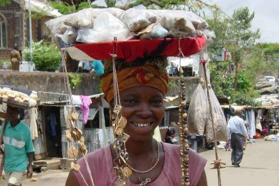 Woman selling traditional medicine in Freetown.