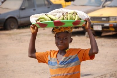Boy selling fruit in Kakata, Liberia