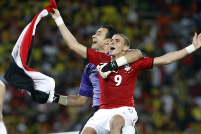 Essam Al Hadari and Mohamed Zidan of Egypt celebrate their team's victory in the 2010 Africa Cup of Nations tournament.