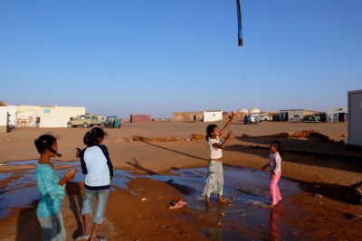 Sahrawi refugee camp Dakhla in southwest Algeria. Girls playing with water.