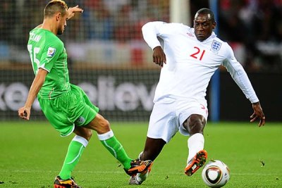 Algeria's Karim Ziani, left, and England's Emile Heskey battle for the ball.