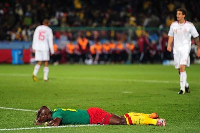 Cameroon's Achille Emana lies dejected after missing a chance to scored.
