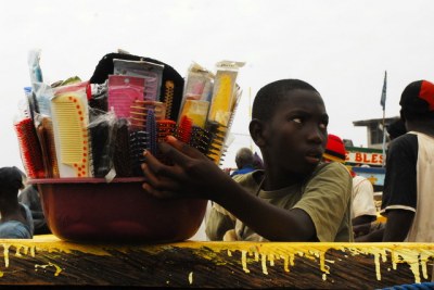 A young boy vending wares in Accra.