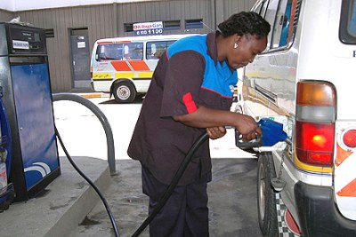 A petrol station attendant fuels a matatu. The Energy Ministry has gazetted new regulations to be used by oil marketers in determination of fuel prices. The pricing structure ends an era of arbitrary price increases that oil marketers have enjoyed since 1994.