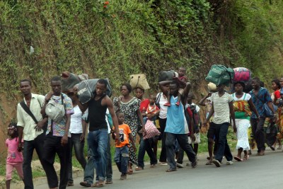 Refugees fleeing fighting in Cote d'Ivoire.(file photo)