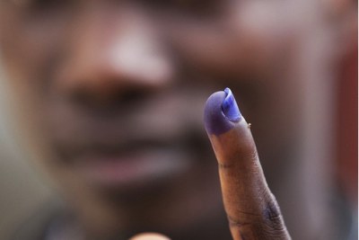 Marked: A Liberian holds up his ink-stained finger, proof of having voted in his countrys constitutional referendum.