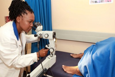 Dr. Sengeziwe Sibeko conducts a gynaecological exam.