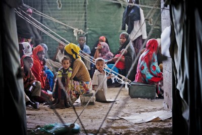 Women and children await treatment in Somalia.