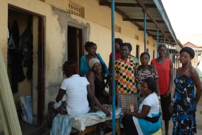 Merlin community workers with sex workers on the Ugandan border, South Sudan.