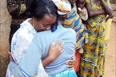 Left, Geraldine Mukakabego reunites with mother after 18 years of living in Zambia (file photo).