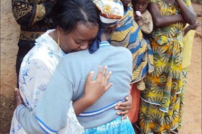Gerardine Mukakabego (L), a Rwandan refugee living in Zambia shed tears of joy when she met her mother for the first time since 1994.