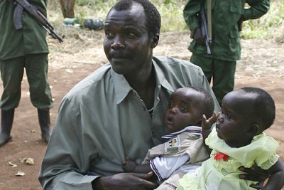 Joseph Kony holds his daughters at a past peace negotiation meet (file photo).