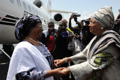 Malawian President Banda greets her counterpart on arrival in Monrovia.