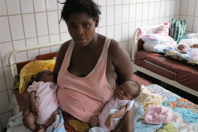 A 33-year-old woman at a clinic in the capital, Kinshasa, holds her second set of twins. She has seven children total.