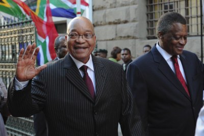 President Jacob Zuma waves while walking with Parliament Speaker Max Sisulu at the 2012 State of the Nation Address in Cape Town.