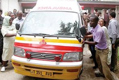 Doctors and nurses push an ambulance carrying Dr. Steven Ulimboka, a chairman of the Medical Association of Tanzania. Dr. Ulimboka sustained multiple injuries after being assaulted by unidentified people.