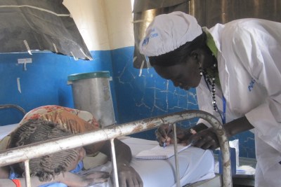 A nurse attends to an expectant mother in South Sudan