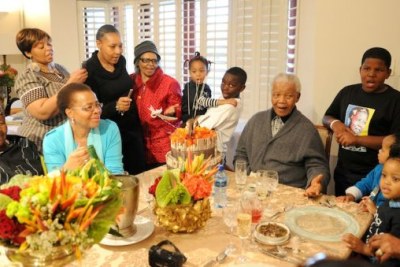 Nelson Mandela surrounded by his family on his 94th birthday.