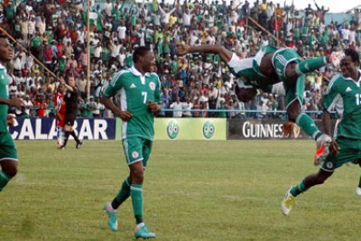 Nigeria's Super Eagles celebrating a goal against Liberia.