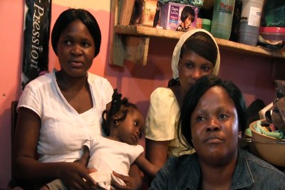 Jennifer Iwu (bottom right) is a volunteer and educates her community about family planning from her hair salon in Abuja.