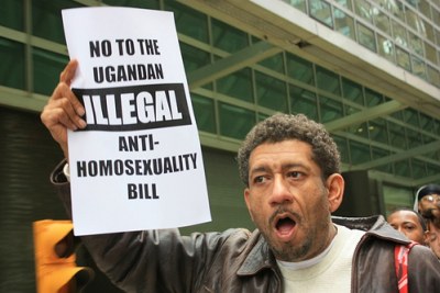 A protester holds up a sign at a rally against Uganda's Anti-Homosexuality Bill.