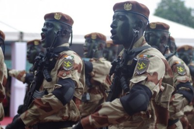 Members of Cote d'Ivoire's armed forces march during the country's Independence Day celebrations on Aug. 7.