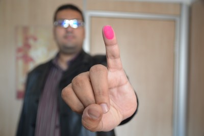 A voter showed off his ink-blotted finger during the last referendum on constitutional amendments to signify he had voted (file photo).