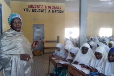 Facilitator Hasiya Mohammed presents geography lessons at City Women's Center in Kano.