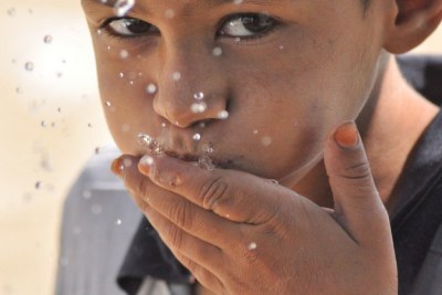 A little boy enjoying the precious liquid (file photo).