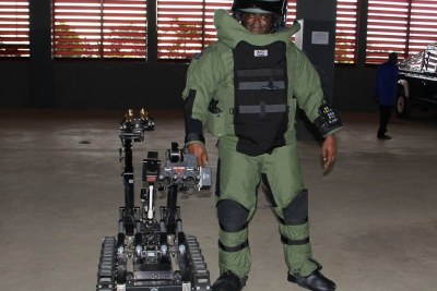 Police Officer With Bomb Disposal Equipment.