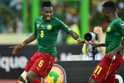 Midfielder Ambroise Oyongo celebrates after showing his class with a well-taken goal for Cameroon on Tuesday night.