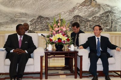 Wang Jiarui (R), head of the International Department of the Communist Part of China Central Committee, meets with visiting Zimbabwean Vice President Emmerson Mnangagwa, in Beijing, China, July 7, 2015. (File Photo)