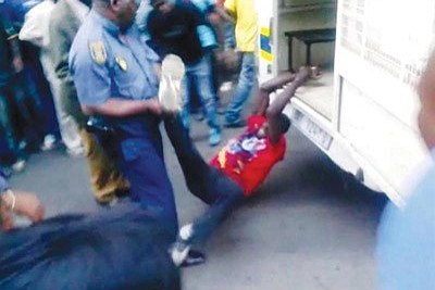 Screenshot from a video of taxi driver Mido Macia being dragged by a police van (file photo).