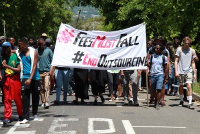 University of Cape Town (UCT) Students watch as protesters march to different parts of the campus during a university shut down.