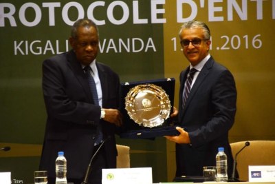 CAF president Issa Hayatou (Left) and his AFC counterpart Shaikh Salman Bin Ibrahim Al Khalifa during the signing ceremony.