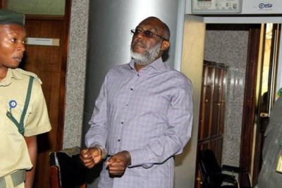 Olisa Metuh in handcuffs, appearing in court.