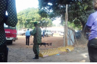 A soldier guards the main entrance to Gulu Central Police Station.