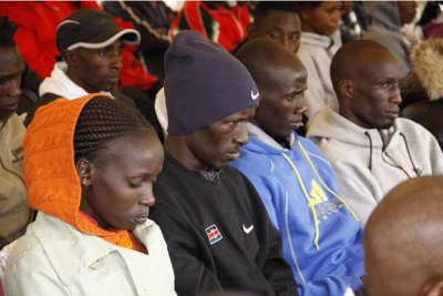 Athletes follow the proceedings during a meeting with Sports Cabinet Secretary Hassan Wario, who was accompanied by governors Alex Tolgos (Elgeyo-Marakwet), Jackson Mandago (Uasin Gishu) and other officials at the High Performance Training Centre, Kazi Mingi Farm in Eldoret on July 12, 2016.