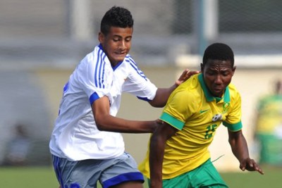 Amajimbos player fights for ball against Mauritius