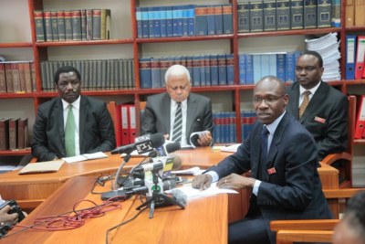 High Court Registrar, Mr Ilvin Mgeta, speaks at news conference in Dares Salaam yesterday,on the sacking of 34 judicial officers, including magistrates from different levels for misconduct.Centre is the Chief Justice, Mohamed Chande Othman, Principla Judg
