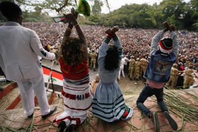 Demonstrators chant slogans while flashing the Oromo protest gesture during Irreecha, the thanksgiving festival of the Oromo people, in Bishoftu town (file photo). The new cabinet has several Oromo members, and it is being seen as a response to the protests.