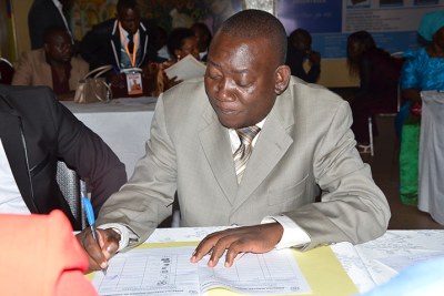 Kato Lubwama signing his nomination papers last year.