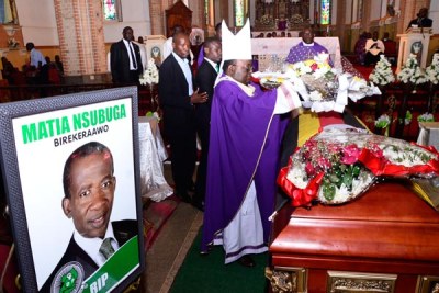 The Archbishop of Kampala Cyprian Kizito Lwanga lays a wreath on the casket containing the body of fallen DP Secretary General Mathias Nsubuga during his requiem mass at Rubaga Cathedral.
