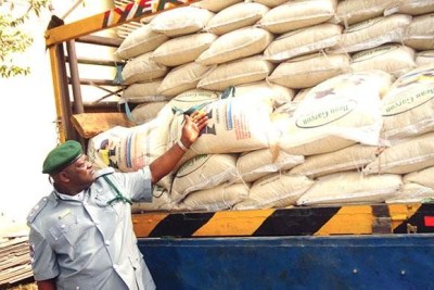 Rice - Customs Area Commander, Oyo/Osun shows smuggled bags of rice intercepted by the command.
