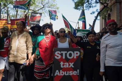 Protesters march to the Union Buildings to demonstrate against President Zuma's decision to fire his finance minister (file photo).
