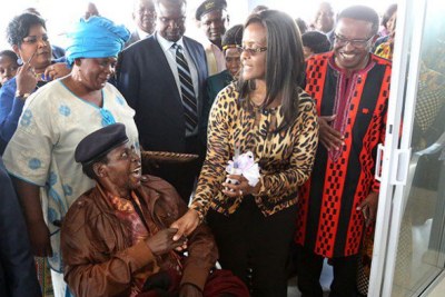 First Lady Grace Mugabe with Cde Chinx (seated in a wheelchair)’s house handover ceremony in Sentosa, Harare,