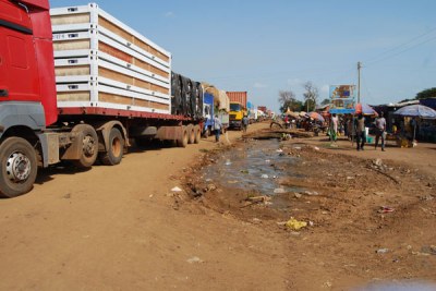 Trucks loaded with goods queue up for clearance at a Uganda-South Sudan border post.