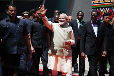India's Prime Minister Narenda Modi escorted by AfDB president Akinwumi Adesina arrive at the opening ceremonies of the 2017 Annual Meetings of the African Development Bank (AfDB), which opened in Ahmedabad, India, on Tuesday, May 23, 2017. In his speech, prime minister Modi reiterated the centuries-old strong ties between India and Africa, noting that India’s partnership with Africa is based on a model of cooperation that is responsive to the needs of Africa.