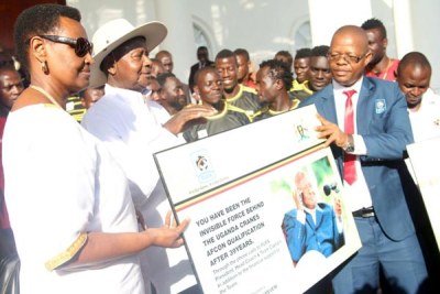 Presidential support. President Museveni and the First Lady Janet receiving a board from Fufa president Magogo in recognition of the support Uganda Cranes enjoyed from government en route a first Africa Cup of Nations apperance in nearly four decades.