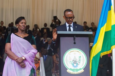 President Kagame takes the presidential oath in the company of First Lady Jeannette Kagame (left) at Amahoro National Stadium in the capital Kigali on Friday, August 18.